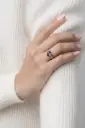 Silver ring with a heart-shaped multicolor stone.