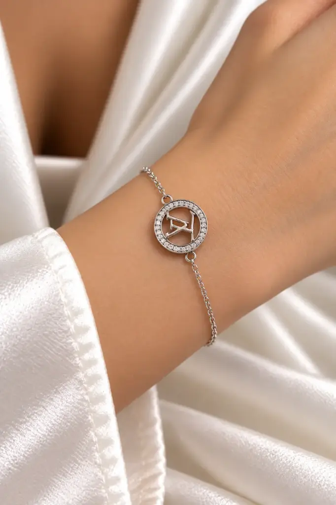 925 sterling silver bracelet with LV lettering inside a white stone-set circular frame.